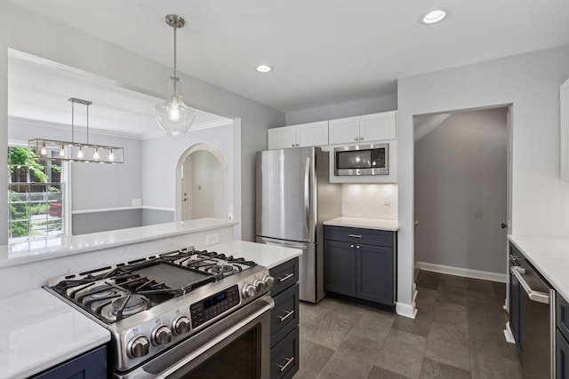 5620 Stevens Ave, Minneapolis, MN 55419 - kitchen featuring appliances with stainless steel finishes, light countertops, pendant lighting, recessed lighting, and white cabinets