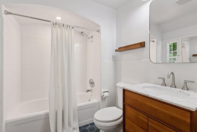 5620 Stevens Ave, Minneapolis, MN 55419 - full bath with shower / tub combo, tile walls, vanity, tile patterned floors, and wainscoting