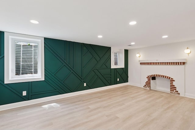 5620 Stevens Ave, Minneapolis, MN 55419 - unfurnished living room featuring wood finished floors, a decorative wall, recessed lighting, and a fireplace
