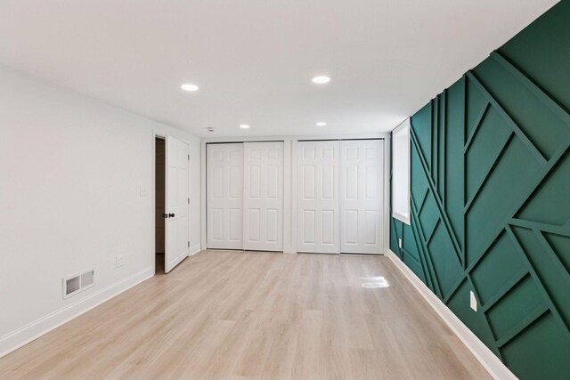 5620 Stevens Ave, Minneapolis, MN 55419 - unfurnished bedroom with two closets, light wood-type flooring, and recessed lighting