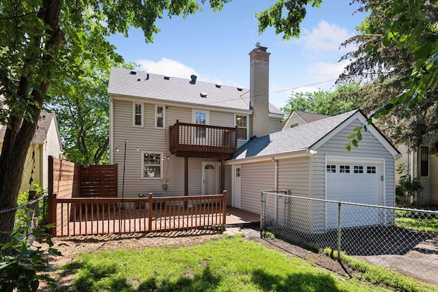 5620 Stevens Ave, Minneapolis, MN 55419 - back of property featuring a balcony, an attached garage, a chimney, an outbuilding, and a wooden deck