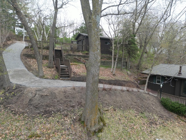 view of yard with stairway and a wooden deck