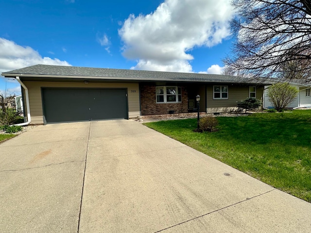 ranch-style home with concrete driveway, an attached garage, and a front lawn