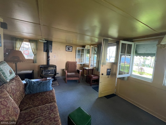 1219 Shore Dr, Luck, WI 54853 - carpeted living room featuring a wood stove