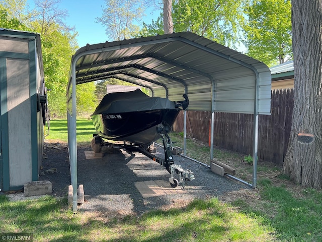 1219 Shore Dr, Luck, WI 54853 - view of parking with a detached carport and fence