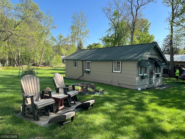 1219 Shore Dr, Luck, WI 54853 - rear view of property with a yard and a shingled roof