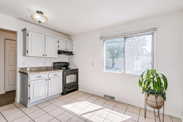 465 Dorland Ct S, Maplewood, MN 55119 - kitchen featuring visible vents, black electric range, baseboards, under cabinet range hood, and white cabinetry