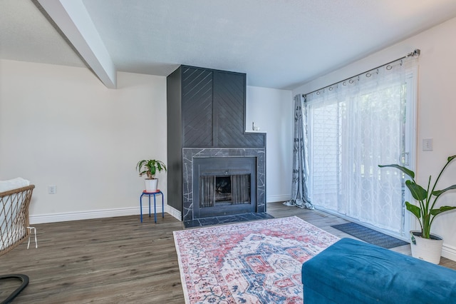 465 Dorland Ct S, Maplewood, MN 55119 - living room featuring baseboards, wood finished floors, and a large fireplace