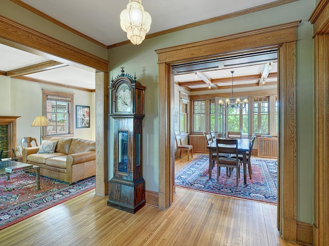 760 Linwood Ave, Saint Paul, MN 55105 - dining space featuring a chandelier, light wood finished floors, beam ceiling, coffered ceiling, and baseboards