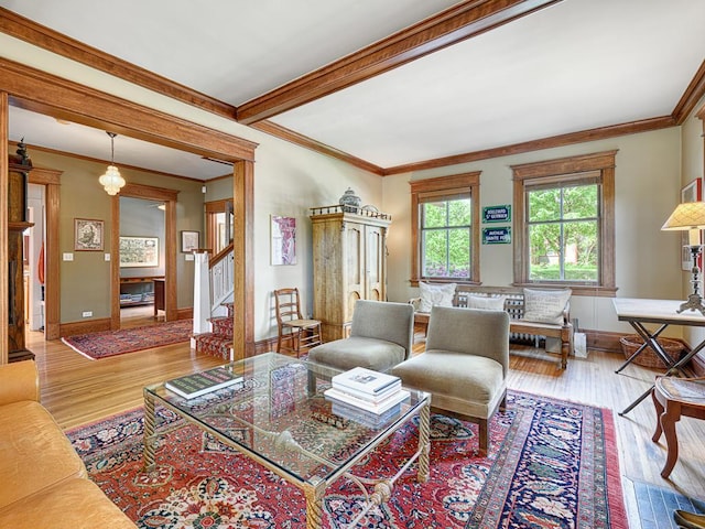 760 Linwood Ave, Saint Paul, MN 55105 - living room with wood finished floors, stairway, crown molding, and baseboards