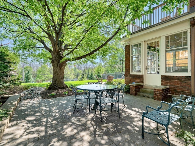760 Linwood Ave, Saint Paul, MN 55105 - view of patio / terrace with outdoor dining area, a balcony, and entry steps