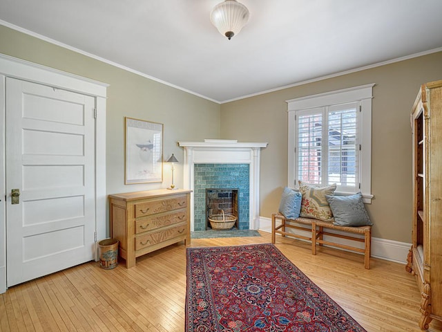 760 Linwood Ave, Saint Paul, MN 55105 - sitting room featuring light wood-style flooring, crown molding, a fireplace, and baseboards
