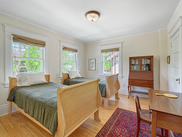 760 Linwood Ave, Saint Paul, MN 55105 - bedroom featuring light wood-style floors, ornamental molding, and baseboards