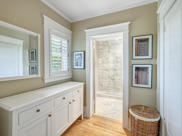 760 Linwood Ave, Saint Paul, MN 55105 - bathroom featuring a tile shower, wood finished floors, ornamental molding, and vanity