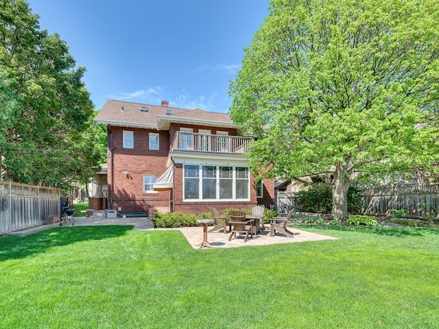 760 Linwood Ave, Saint Paul, MN 55105 - back of property with a balcony, a patio, and brick siding