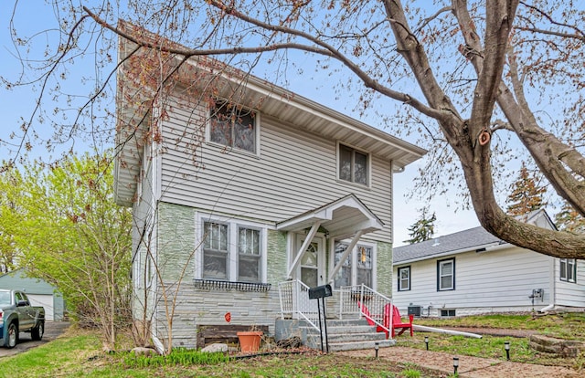 view of front of home with a detached garage
