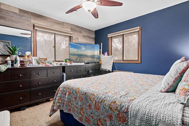 carpeted bedroom with a ceiling fan
