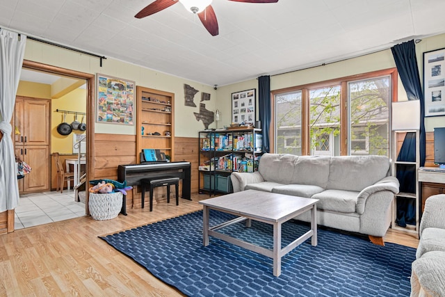 living area featuring ceiling fan and wood finished floors