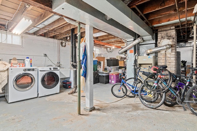 below grade area with washing machine and clothes dryer