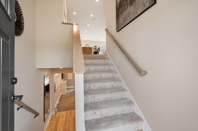 6758 Wildflower Way, Minnetrista, MN 55331 - stairs with recessed lighting, wood finished floors, and baseboards