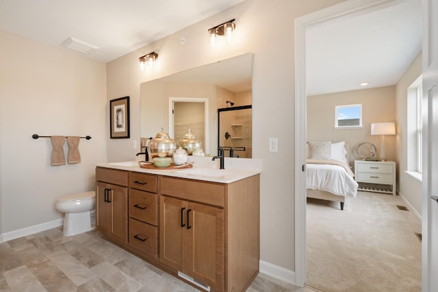 6758 Wildflower Way, Minnetrista, MN 55331 - ensuite bathroom featuring a tile shower, double vanity, toilet, and baseboards