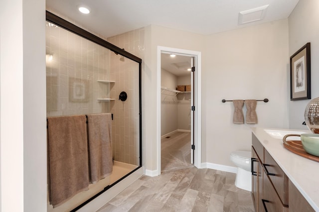 6758 Wildflower Way, Minnetrista, MN 55331 - full bath featuring a stall shower, toilet, vanity, and a walk in closet