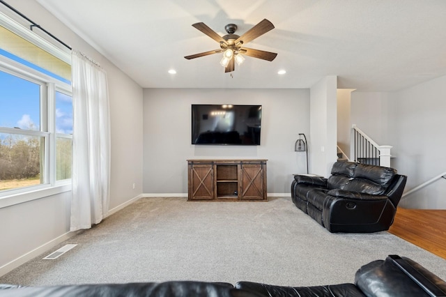 10610 275th Ave NW, Zimmerman, MN 55398 - living area with ceiling fan, carpet floors, baseboards, recessed lighting, and stairway