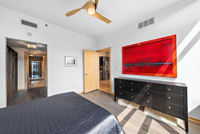 215 10th Ave S Unit 703, Minneapolis, MN 55415 - bedroom featuring wood finished floors and ceiling fan