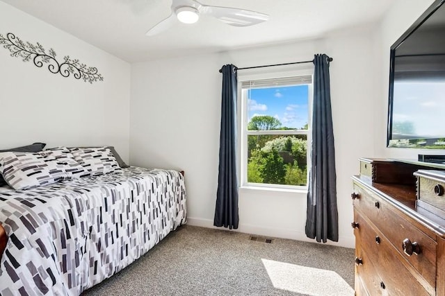 bedroom featuring carpet flooring, a ceiling fan, and baseboards