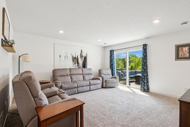 carpeted living room with recessed lighting and a textured ceiling