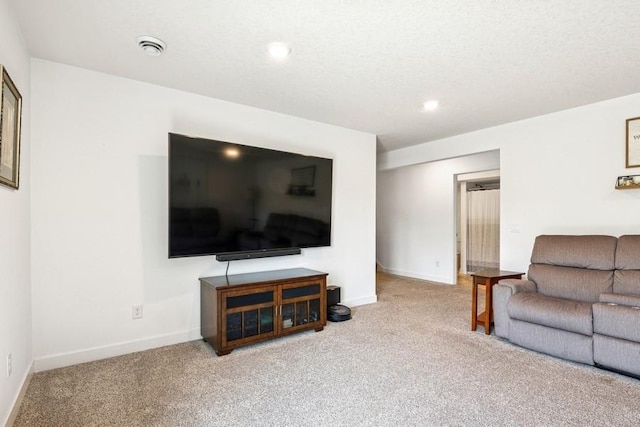 living area with carpet, baseboards, and recessed lighting