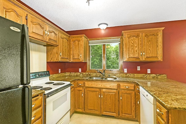 204 10th Ave N, Cold Spring, MN 56320 - kitchen featuring white appliances, brown cabinets, a peninsula, and a textured ceiling