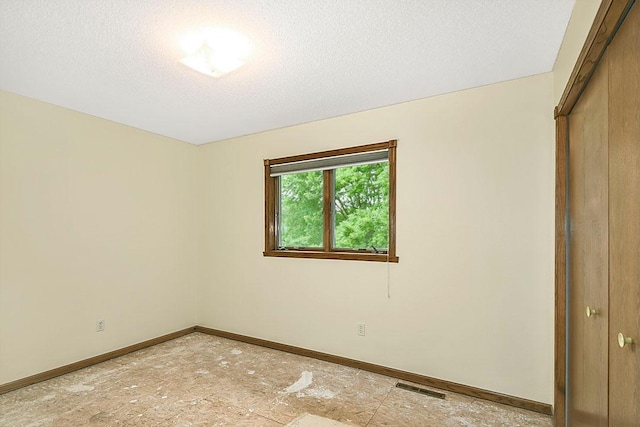 204 10th Ave N, Cold Spring, MN 56320 - unfurnished bedroom with a textured ceiling and a closet