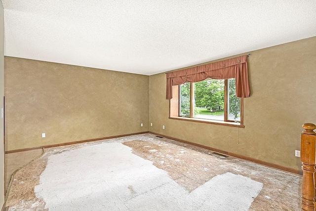 204 10th Ave N, Cold Spring, MN 56320 - unfurnished room featuring a textured ceiling and baseboards
