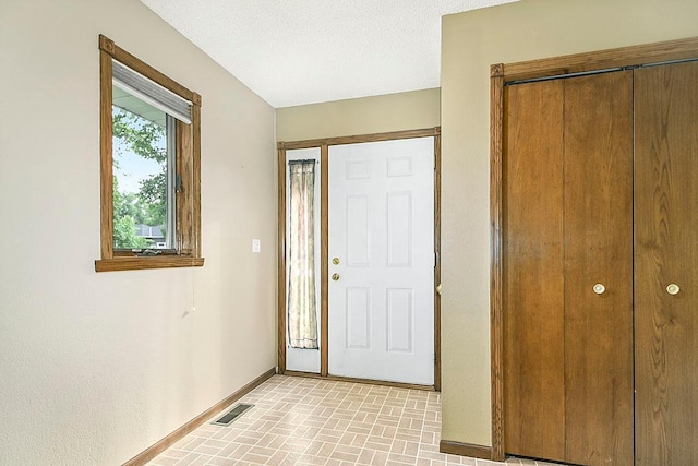 204 10th Ave N, Cold Spring, MN 56320 - foyer entrance with baseboards and brick patterned floors
