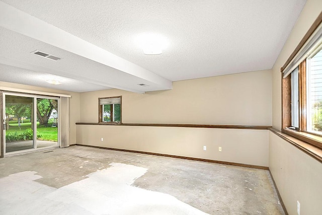 204 10th Ave N, Cold Spring, MN 56320 - unfurnished room featuring concrete floors and a textured ceiling