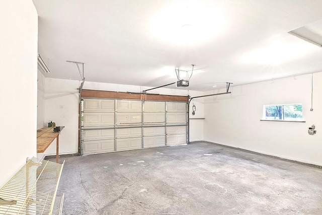 204 10th Ave N, Cold Spring, MN 56320 - garage featuring a garage door opener and baseboards