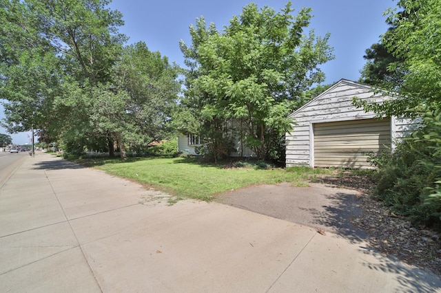 203 Main St, Crosby, MN 56441 - view of grassy yard with an outdoor structure and a detached garage