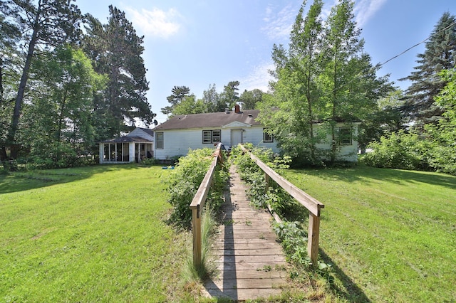 203 Main St, Crosby, MN 56441 - view of front facade featuring a front lawn and a chimney