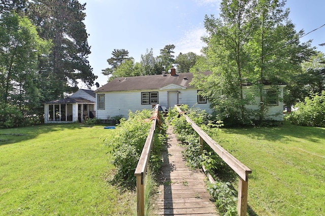 203 Main St, Crosby, MN 56441 - back of property with a yard and a chimney