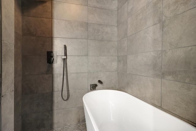 full bath featuring a soaking tub