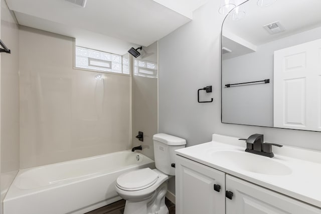 bathroom with vanity, toilet, shower / tub combination, and visible vents