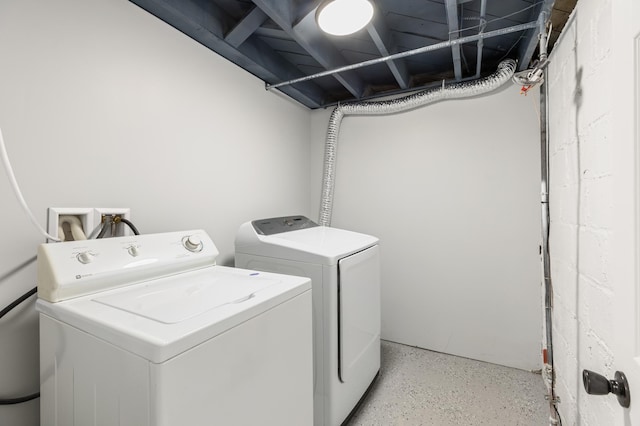washroom with separate washer and dryer and laundry area