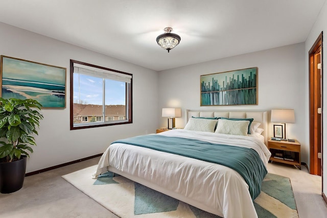 bedroom featuring carpet floors and baseboards