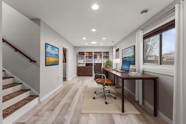 office featuring baseboards, recessed lighting, and light wood finished floors