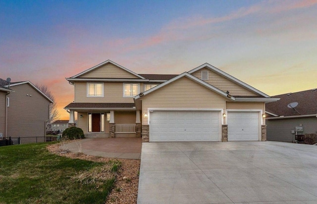 16268 Tahinka Ct NW, Prior Lake, MN 55372 - craftsman-style house featuring driveway, an attached garage, and a porch