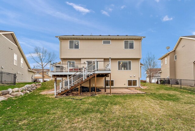 16268 Tahinka Ct NW, Prior Lake, MN 55372 - back of house featuring stairway, a wooden deck, and a patio