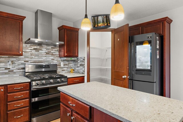 16268 Tahinka Ct NW, Prior Lake, MN 55372 - kitchen with wall chimney range hood, stainless steel range with gas stovetop, smart refrigerator, decorative backsplash, and hanging light fixtures