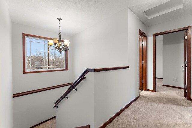 16268 Tahinka Ct NW, Prior Lake, MN 55372 - stairs with carpet, baseboards, and a chandelier