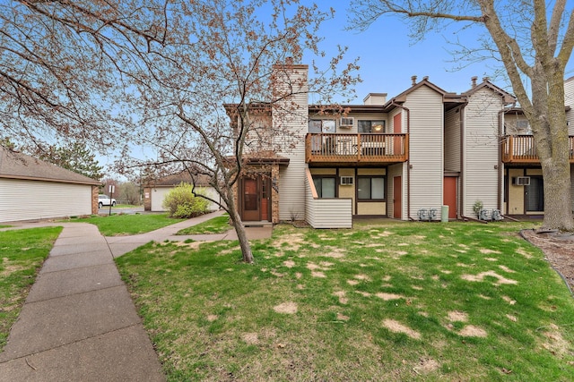 2071 Parkside Dr Unit 30, Saint Paul, MN 55119 - back of house featuring a lawn, a chimney, and a deck